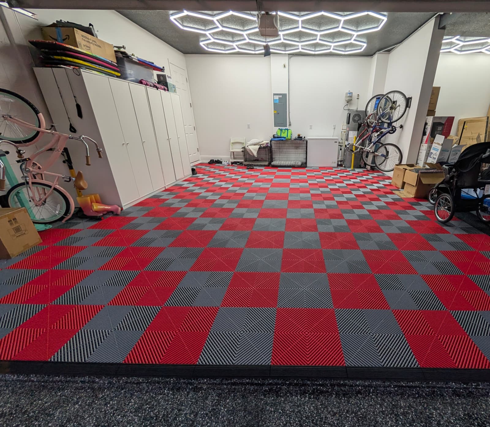 Red and gray modular garage floor tiles with hex lighting